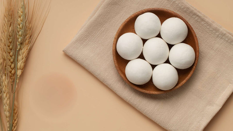 Seven wool dryer balls in a basket—Should I wet my dryer balls?